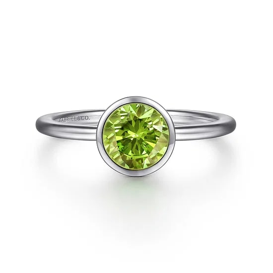 SS .91CT PERIDOT BEZEL RING SZ 6.5