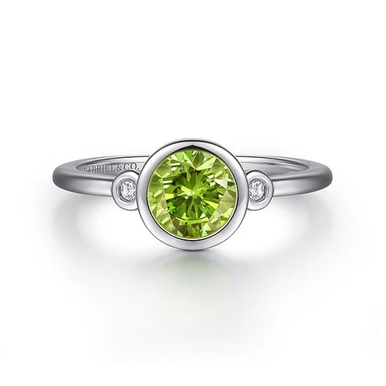 SS .81CT PERIDOT .04CTW DIA BEZEL ACCENT RING SZ6.5
